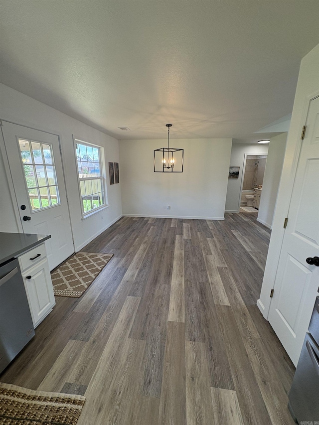 1901 N 19th St, Paragould, AR 72450 - unfurnished dining area with a chandelier and dark wood-style floors