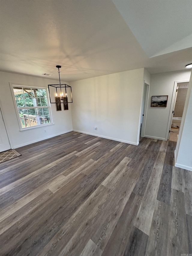 1901 N 19th St, Paragould, AR 72450 - unfurnished dining area featuring a chandelier and dark wood-type flooring