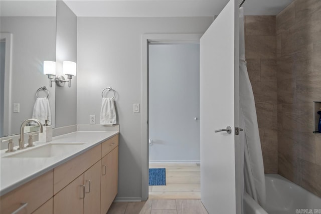 300 E Third St # 509, Little Rock, AR 72201 - bathroom with vanity, shower / bath combo with shower curtain, and tile patterned flooring