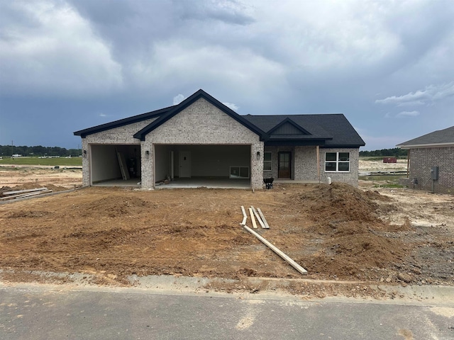 149 Kelton Ln, Hensley, AR 72065 - view of front of home featuring brick siding and an attached garage