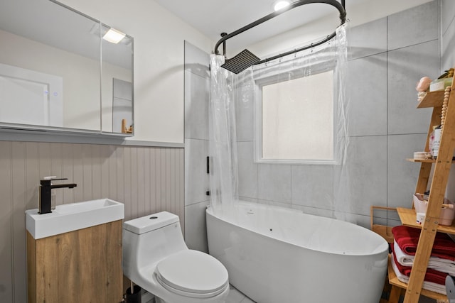 117 N Summit St, Little Rock, AR 72205 - bathroom with wainscoting, shower / tub combo, and vanity