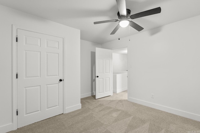 25501 Kanis Rd, Little Rock, AR 72223 - unfurnished bedroom featuring light carpet and a ceiling fan