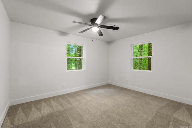 25501 Kanis Rd, Little Rock, AR 72223 - carpeted empty room with healthy amount of natural light and a ceiling fan