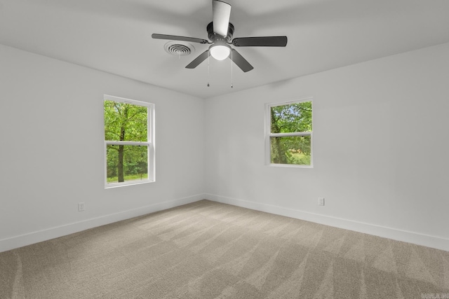 25501 Kanis Rd, Little Rock, AR 72223 - empty room featuring healthy amount of natural light, carpet floors, and a ceiling fan