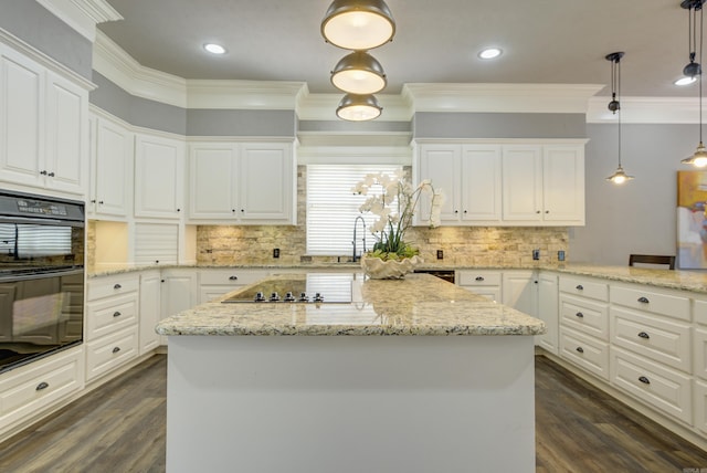 kitchen with black appliances, dark wood-style floors, ornamental molding, white cabinetry, and recessed lighting