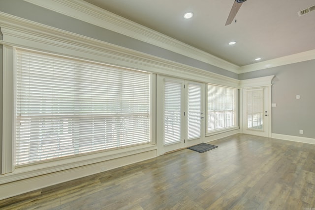 unfurnished room featuring a ceiling fan, healthy amount of natural light, crown molding, wood finished floors, and recessed lighting