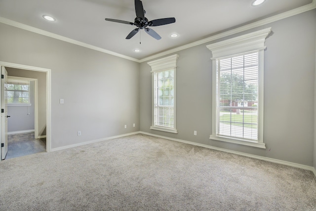 carpeted spare room featuring crown molding, ceiling fan, and recessed lighting