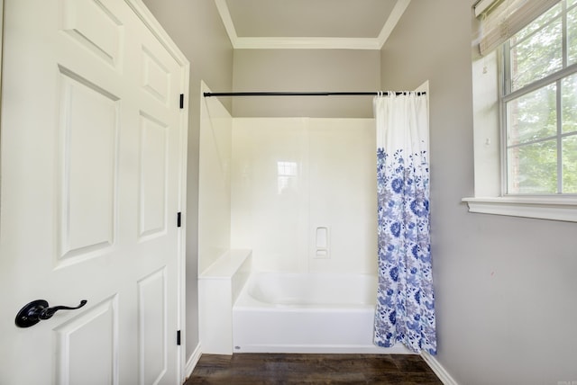 bathroom with ornamental molding, shower / tub combo with curtain, and wood finished floors