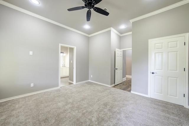 unfurnished bedroom featuring carpet, crown molding, recessed lighting, connected bathroom, and ceiling fan