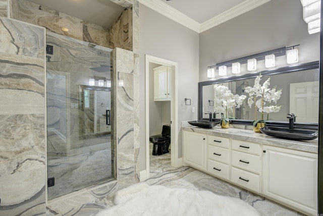 bathroom with a marble finish shower, marble finish flooring, double vanity, and ornamental molding