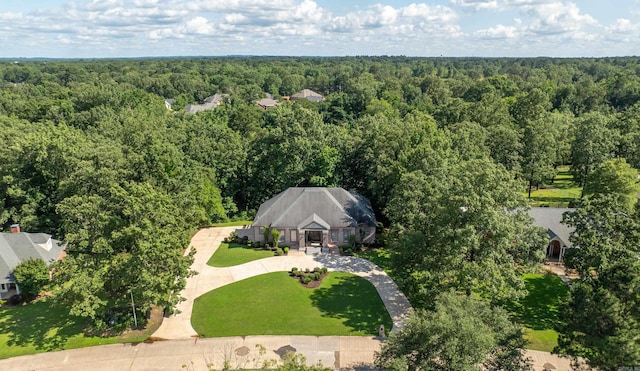 view of subject property featuring a forest