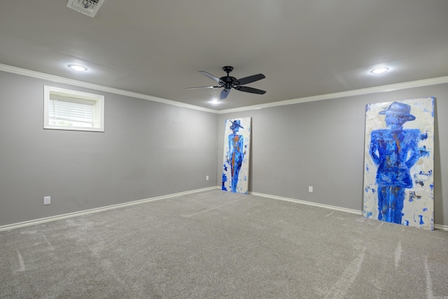 spare room featuring crown molding, carpet flooring, a ceiling fan, and recessed lighting