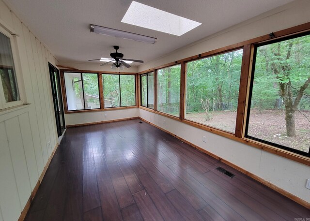 1 Sierra Ln, Hot Springs Village, AR 71909 - unfurnished sunroom featuring a skylight and wood finished floors