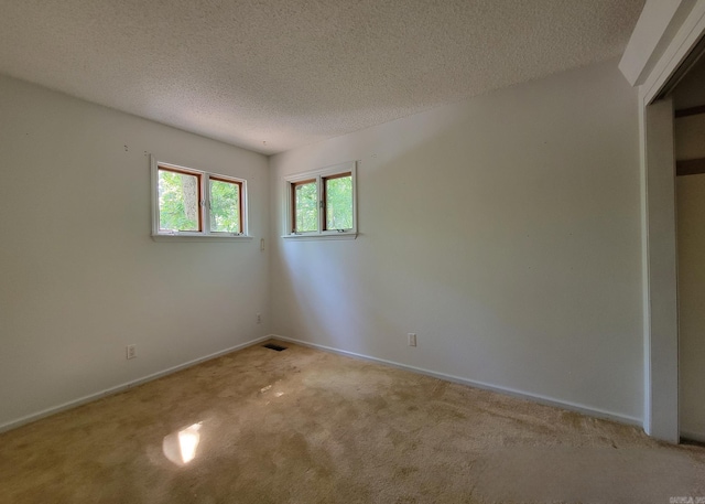 1 Sierra Ln, Hot Springs Village, AR 71909 - carpeted spare room with a textured ceiling and baseboards