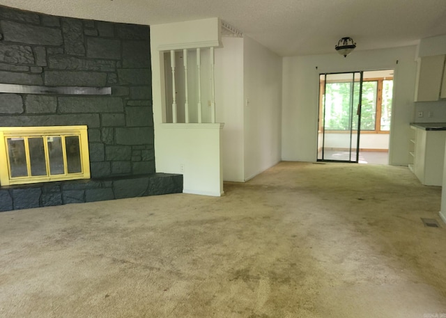 1 Sierra Ln, Hot Springs Village, AR 71909 - unfurnished living room featuring a stone fireplace and carpet flooring