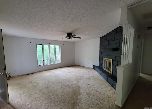1 Sierra Ln, Hot Springs Village, AR 71909 - unfurnished living room with ceiling fan, a stone fireplace, carpet, and a textured ceiling