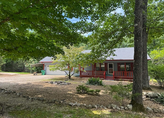 57 Cherokee Acres Dr, Cherokee Village, AR 72529 - view of front of property featuring covered porch, a carport, and dirt driveway