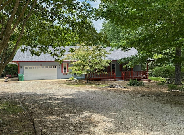 57 Cherokee Acres Dr, Cherokee Village, AR 72529 - view of front of home featuring dirt driveway, a garage, and roof with shingles