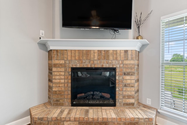 526 NW 62nd Ave, Bentonville, AR 72713 - detailed view of a brick fireplace and baseboards