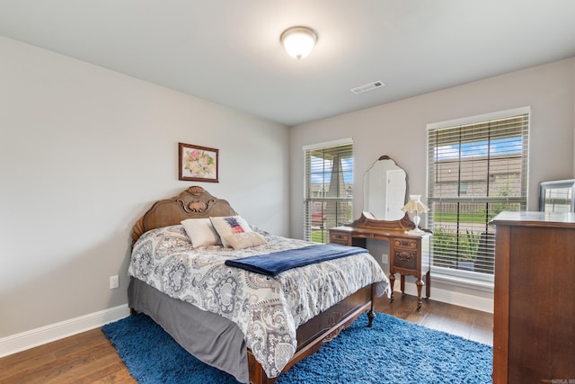 526 NW 62nd Ave, Bentonville, AR 72713 - bedroom with baseboards and wood finished floors