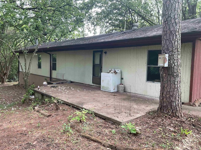 39 Holley Rd, Edgemont, AR 72044 - back of house featuring washer / dryer, a shingled roof, and a patio area