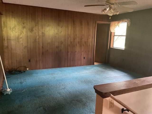 39 Holley Rd, Edgemont, AR 72044 - carpeted empty room with wood walls and ceiling fan