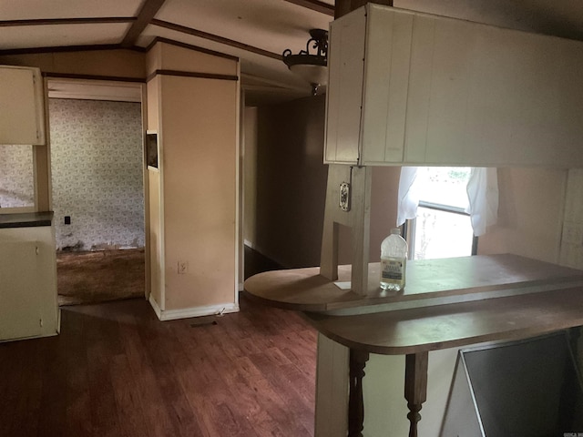 39 Holley Rd, Edgemont, AR 72044 - kitchen with dark wood-style flooring, vaulted ceiling, and white cabinetry