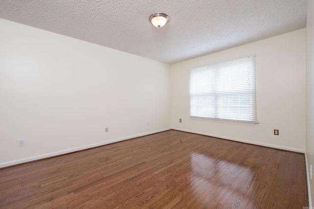 520 Cambridge Place Dr, Little Rock, AR 72227 - empty room featuring wood finished floors and a textured ceiling