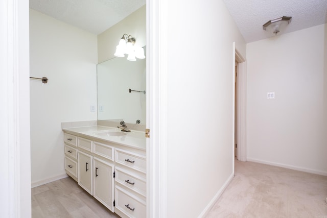 520 Cambridge Place Dr, Little Rock, AR 72227 - bathroom with vanity and a textured ceiling