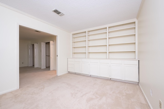 520 Cambridge Place Dr, Little Rock, AR 72227 - unfurnished room featuring light colored carpet, a textured ceiling, and ornamental molding