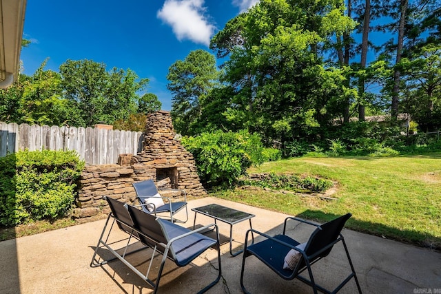 7300 Amherst Dr, Little Rock, AR 72205 - view of patio featuring an outdoor stone fireplace
