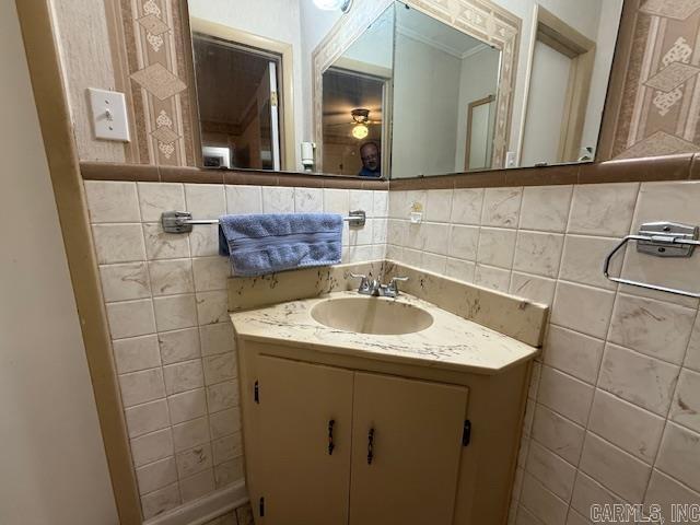 209 Crouch St, Benton, AR 72015 - bathroom featuring tile walls and vanity