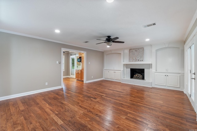 300 Beaconsfield Rd, Sherwood, AR 72120 - unfurnished living room featuring a ceiling fan, wood finished floors, ornamental molding, a fireplace with raised hearth, and recessed lighting