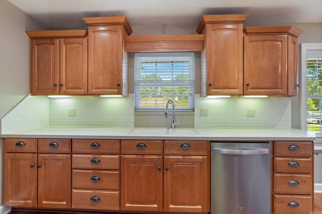 300 Beaconsfield Rd, Sherwood, AR 72120 - kitchen with stainless steel dishwasher, light countertops, and backsplash
