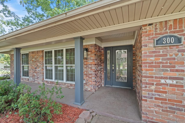 300 Beaconsfield Rd, Sherwood, AR 72120 - view of exterior entry featuring brick siding and covered porch