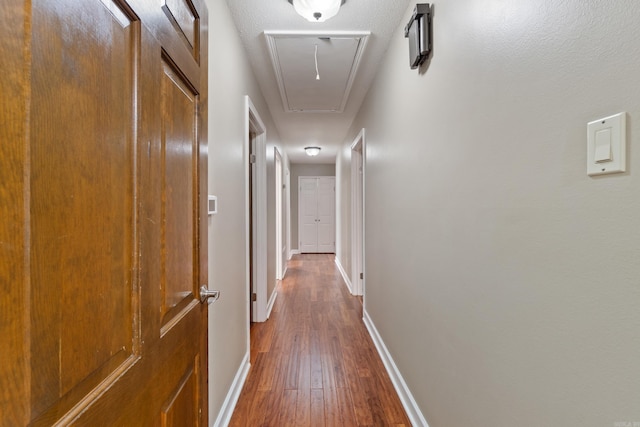 300 Beaconsfield Rd, Sherwood, AR 72120 - hallway with attic access and dark wood-type flooring