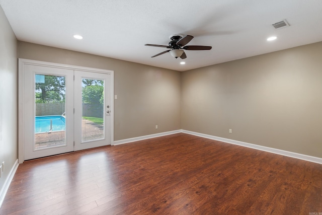 300 Beaconsfield Rd, Sherwood, AR 72120 - spare room with dark wood-style flooring, ceiling fan, and recessed lighting