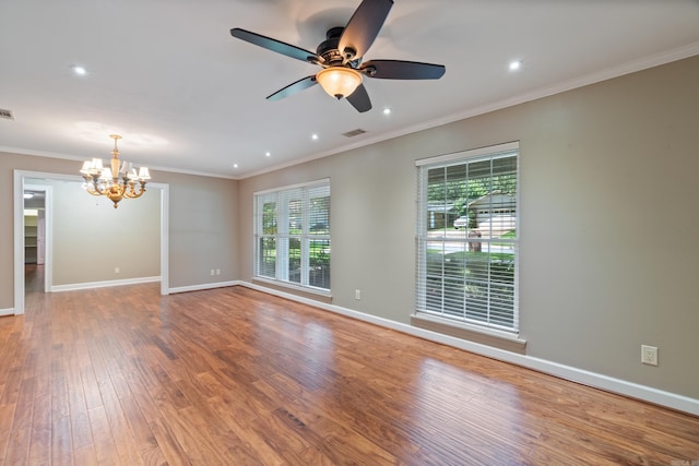 300 Beaconsfield Rd, Sherwood, AR 72120 - spare room featuring a chandelier, a ceiling fan, crown molding, wood finished floors, and recessed lighting