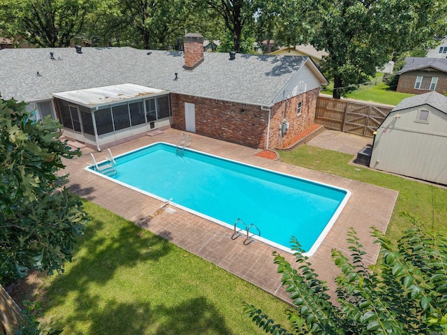 300 Beaconsfield Rd, Sherwood, AR 72120 - view of pool with a sunroom, a shed, a fenced backyard, and a patio