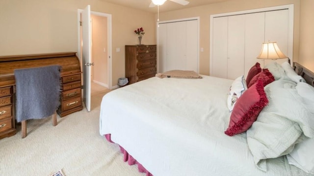 10 Abaron Pl, Hot Springs Village, AR 71909 - bedroom featuring multiple closets, light colored carpet, and a ceiling fan