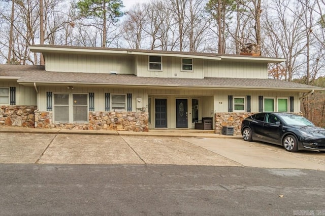 10 Abaron Pl, Hot Springs Village, AR 71909 - view of front of property featuring stone siding, a chimney, and roof with shingles