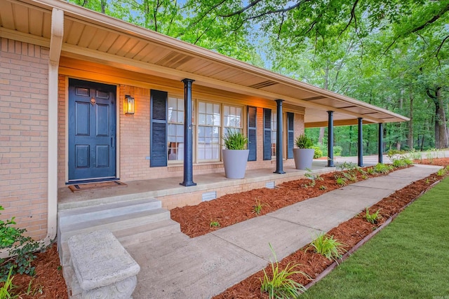 20 Robinwood Rd, Little Rock, AR 72227 - property entrance with a porch and brick siding