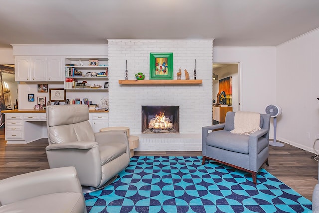 20 Robinwood Rd, Little Rock, AR 72227 - living room featuring dark wood finished floors, ornamental molding, and a brick fireplace
