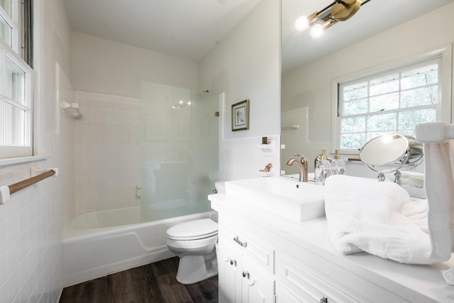 20 Robinwood Rd, Little Rock, AR 72227 - full bathroom featuring tile walls, vanity, wood finished floors, and bathing tub / shower combination