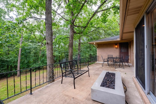 20 Robinwood Rd, Little Rock, AR 72227 - view of patio with a fire pit and outdoor dining space