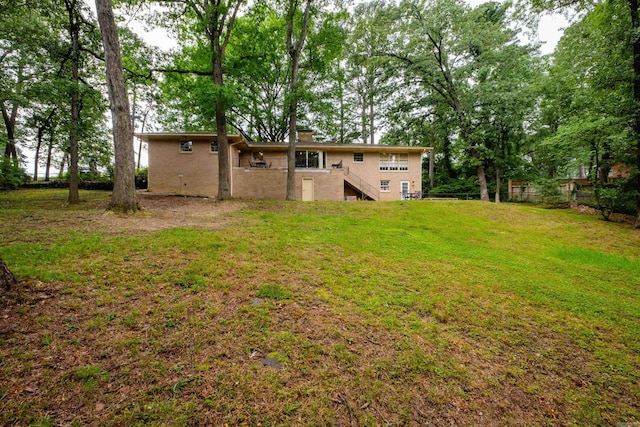 20 Robinwood Rd, Little Rock, AR 72227 - rear view of house with stairs and a chimney