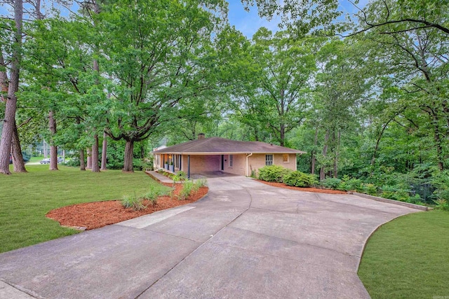 20 Robinwood Rd, Little Rock, AR 72227 - ranch-style home with concrete driveway, a front yard, a chimney, and a carport