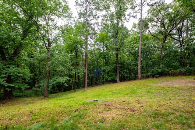 20 Robinwood Rd, Little Rock, AR 72227 - view of green lawn with a wooded view