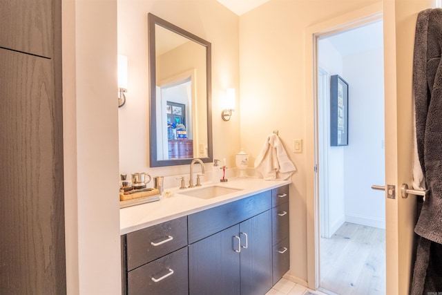 300 E 3rd St Unit 602, Little Rock, AR 72201 - bathroom featuring vanity and wood finished floors