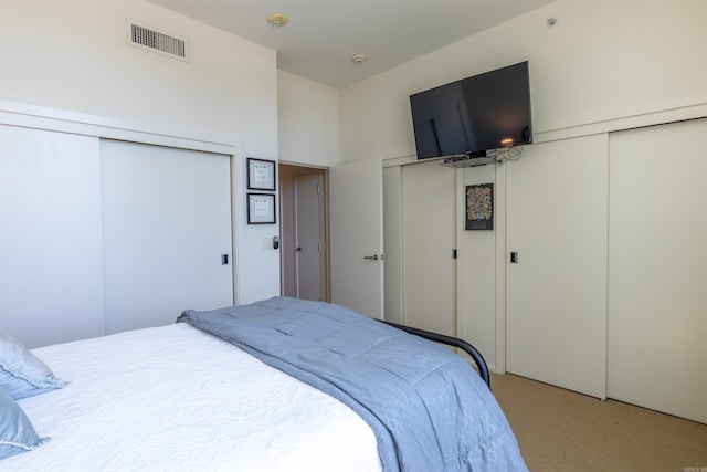 300 E 3rd St Unit 602, Little Rock, AR 72201 - bedroom featuring multiple closets and carpet floors